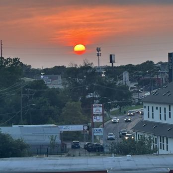 West Koenig Flats Apartment Homes - View from balcony at sunset - Apartments Near Me - Austin, Texas West Koenig Flats Apartment Homes - View from balcony at sunset - Apartments Near Me - Austin, Texas
