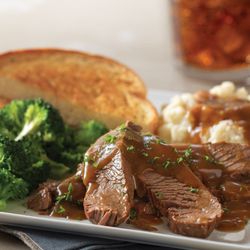Village Inn - Pot Roast Homestyle Dinner, with our braised beef served with mashed potatoes, gravy, + choice of side and a buttery slice of Texas toast