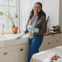 Senior Angels Care - Caregiver assisting with light housekeeping