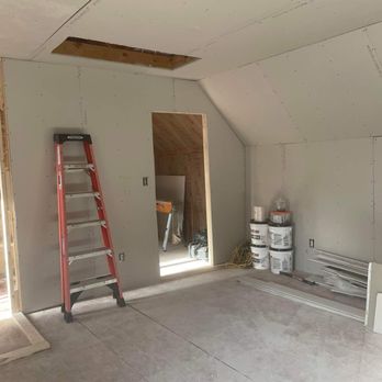 Long Branch Construction - a room with a ladder in it - Decks & Railing Near Me