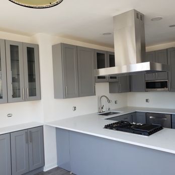 CustomFit Contractors - a kitchen with stainless steel appliances - General Contractors Near Me - Chicago, Illinois
