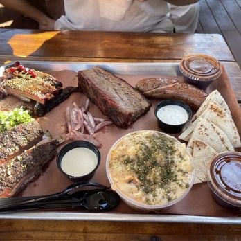 KG BBQ - Brisket, Pomegranate Pork Ribs, Bacon Lamb, sausage, Egyptian Mac N' Cheese served with pita bread and BBQ sauce on the side - Egyptian Near Me - Austin, Texas KG BBQ - Brisket, Pomegranate Pork Ribs, Bacon Lamb, sausage, Egyptian Mac N' Cheese served with pita bread and BBQ sauce on the side - Egyptian Near Me - Austin, Texas