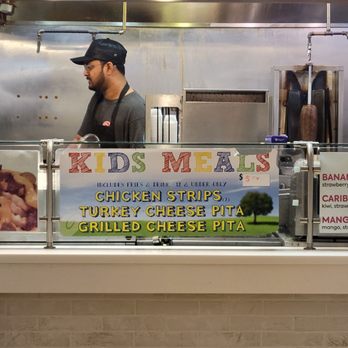 GW Gyro & Wings - a man behind a counter - Wraps Near Me - Des Peres, Missouri GW Gyro & Wings - a man behind a counter - Wraps Near Me - Des Peres, Missouri