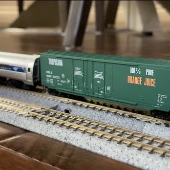 The Train Crossing - A Kato ACS-64 engine on the track 1 with an Amtrak amfleet passenger car with a tropical orange juice transport car attached to it. - Toy Stores Near Me - Costa Mesa, California The Train Crossing - A Kato ACS-64 engine on the track 1 with an Amtrak amfleet passenger car with a tropical orange juice transport car attached to it. - Toy Stores Near Me - Costa Mesa, California