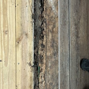 Empire Today - This is the under flooring inside of our dining area, the dark wood is the flooring that was put in the light. What is our deck. - Carpet Installation Near Me