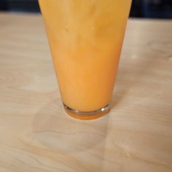Dough Boy's Pizza - Trip to the beach - coconut peach drink with Malibu Rum, Peach Schnapps, Vodka, OJ, pineapple,  and a splash of cranberry - Pizza Near Me - Virginia Beach, Virginia