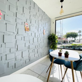 Cha Express - a table and chairs in front of a large window - Bubble Tea Near Me - Alhambra, California