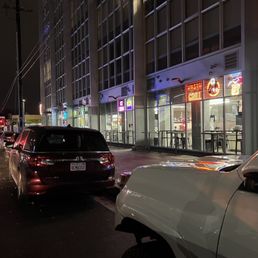 a busy city street at night