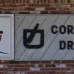 Prescriptions Corner Drug - Close up view of sign