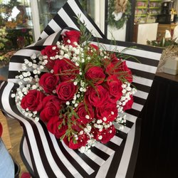 Red roses wrapped to go