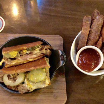 Bosscat Kitchen & Libations - BBQ Porchetta Sandwich and Bosscat Fries. 2/10 - New American Near Me - Houston, Texas