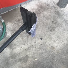 ows a person standing in front of a gas pump