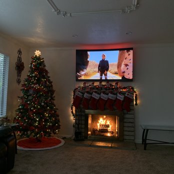 Happy Modern Homes - 65" Samsung Curve over Chimney with Hidden Wires - TV Mounting Near Me