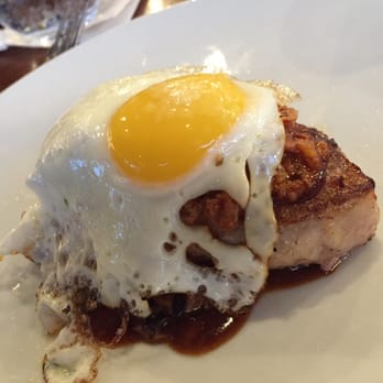 MW Restaurant - On the menu, I didn't see an egg called out on the pork chop but it was a killer addition. - New American Near Me - Honolulu, Hawaii