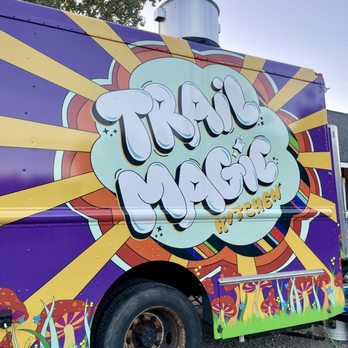 Nocterra Brewing - a colorful food truck - A food truck features a psychedelic mushroom design with bright colors, bold lettering, and a whimsical style, parked outdoors. - Breweries Near Me - Powell, Ohio