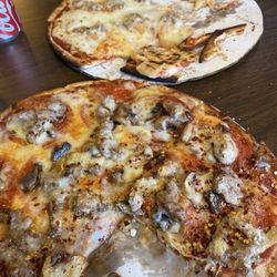 The Fuzzy Pig - Pepperoni, sausage and mushroom in foreground. Sausage only... back