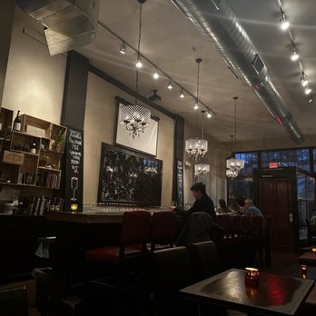 Revel - people sitting at tables in a restaurant - Wine Bars Near Me - Tucson, Arizona
