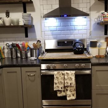 Cabinets To Go - a kitchen with stainless steel appliances - Kitchen & Bath Near Me - Lilburn, Georgia