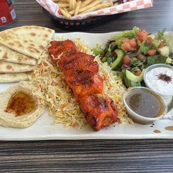 Falafel Flare - Chicken kabob over rice. Salad and naan breads. The hummus was amazing and the green sauce was also great. - Mediterranean Near Me - Hayward, California Falafel Flare - Chicken kabob over rice. Salad and naan breads. The hummus was amazing and the green sauce was also great. - Mediterranean Near Me - Hayward, California
