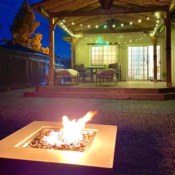 CRE CONSTRUCTION GROUP - a patio with a fire pit - General Contractors Near Me