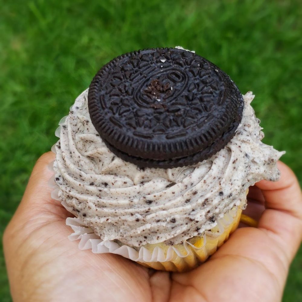 Parks Pastries - a hand holding an oreo cupcake - Cupcakes Near Me - Homewood, Illinois Parks Pastries - a hand holding an oreo cupcake - Cupcakes Near Me - Homewood, Illinois