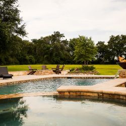 Pooltex American - Spa Over view of the pool and yard.