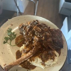 Sapore Ristorante & Pizza Bar - Mashed potatoes, pork chop tomahawk in a Marsala mushroom Demi