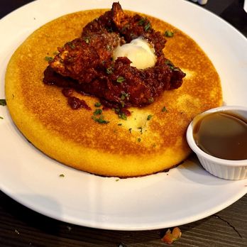 Tom’s Watch Bar - Comfort food corn bread pancake/waffle with yummy syrup, & spicy chicken strips as a contrast. - Sports Bars Near Me - Orlando, Florida