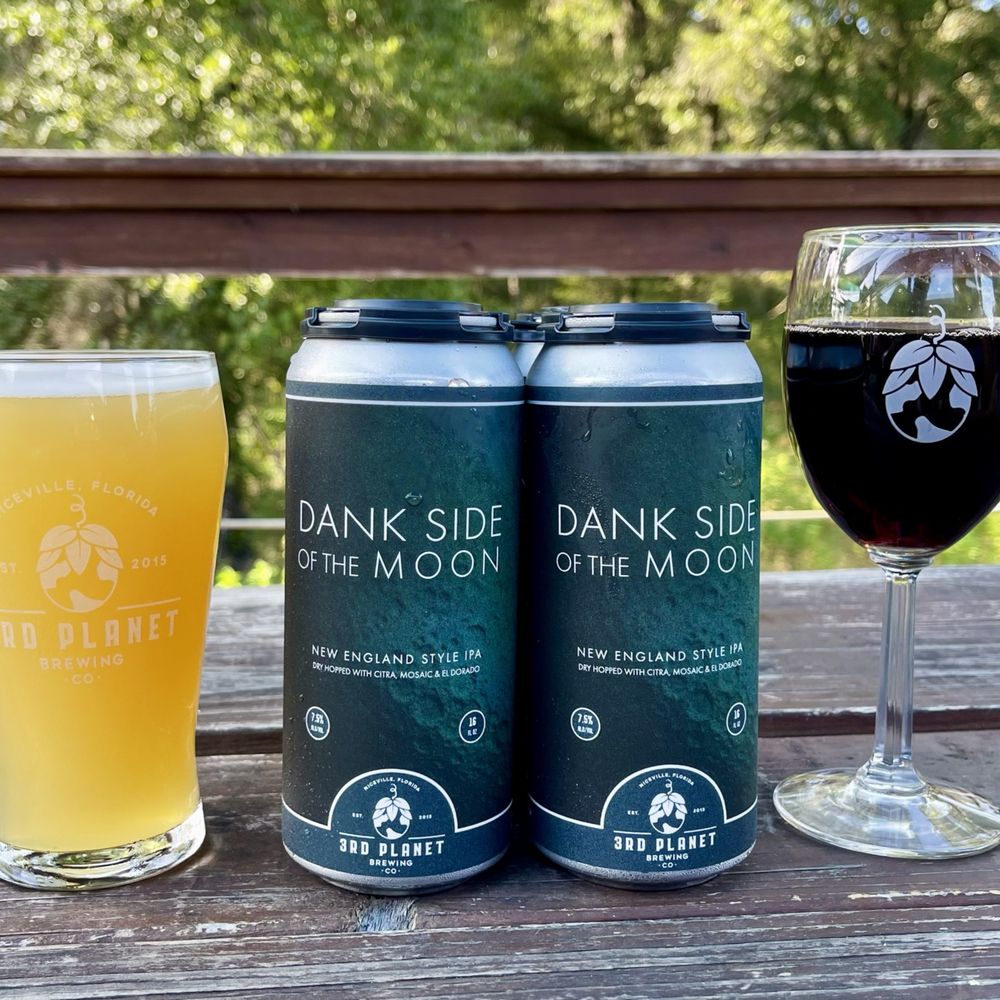 two cans of dark side moon and a glass of red wine two cans of dark side moon and a glass of red wine