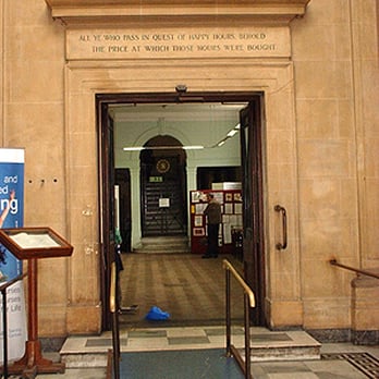 Stoke Newington Library - Over the door it reads 'All ye who pass in quest of happy hours behold the price at which those hours were bought' - Libraries Near Me - London, XGL