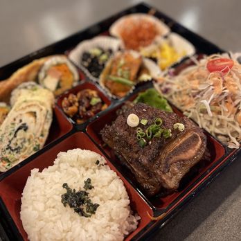 Surah - a bento box filled with different types of food - Korean Near Me - Orlando, Florida Surah - a bento box filled with different types of food - Korean Near Me - Orlando, Florida