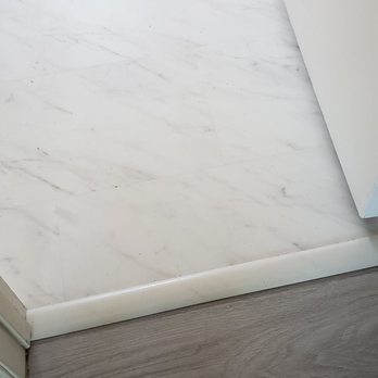 Simply Floors & Painting - Contrast between the new floors in the main room and the bathroom. The owner picked out the bathroom floor and it looks great! - Flooring Near Me - Aurora, Colorado