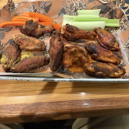 Naked dry rubbed Lemon pepper and buffalo wings a little overcooked but still were very tasty Naked dry rubbed Lemon pepper and buffalo wings a little overcooked but still were very tasty