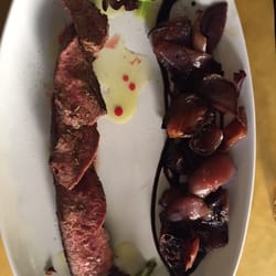 Il Tagliere - Tagliata ( grilled sliced beef) with red onions on balsamico sauce.