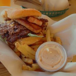 Beast burger with caramelized onions and braised bacon steak