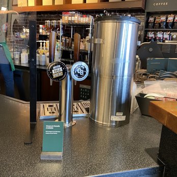 Starbucks - a coffee machine on a counter in a coffee shop - Coffee & Tea Near Me - Rochester, New York Starbucks - a coffee machine on a counter in a coffee shop - Coffee & Tea Near Me - Rochester, New York