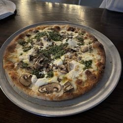 Crusted Pizzastop - Build your own white pizza, garlic, ricotta, fresh mushrooms and pesto