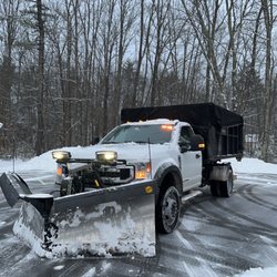 Normand Enterprises - The work truck hauling dumpsters and plowing snow simultaneously!