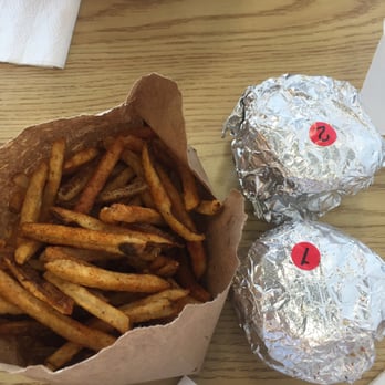 Five Guys - Technique only: we pour our fries into the brown bag and tear the excess and it makes a great container to share our fries - Burgers Near Me - Norman, Oklahoma
