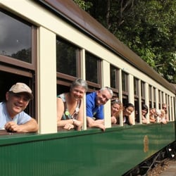 The Cruise Expert - Dean with a group of fun friends aboard the Kuranda rail train in Australia. Put this on your bucket list!
