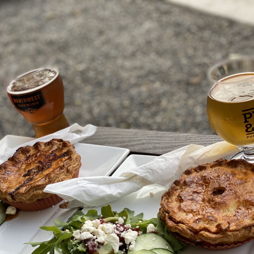 Pint & Pie - a glass of beer and a plate of food - Beer Gardens Near Me - Tacoma, Washington Pint & Pie - a glass of beer and a plate of food - Beer Gardens Near Me - Tacoma, Washington