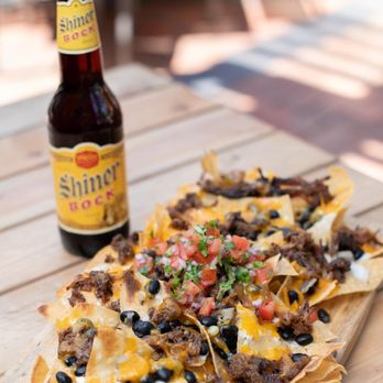 Sambuca 360 - a plate of nachos and a bottle of beer - American Near Me - Plano, Texas Sambuca 360 - a plate of nachos and a bottle of beer - American Near Me - Plano, Texas