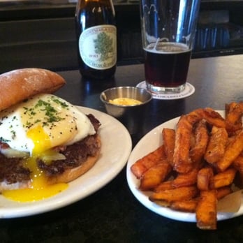 DMK Burger Bar - a #3 (like a reuben), added an over-easy fried egg, sweet potato fries, Christmas ale.  Awesome lunch! - Burgers Near Me - Chicago, Illinois