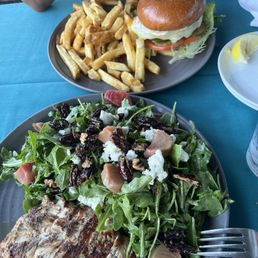 I got the arugula, beet salad with chicken and my boyfriend got the burger I got the arugula, beet salad with chicken and my boyfriend got the burger