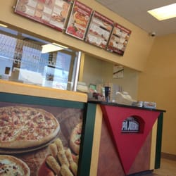 Papa Johns Pizza - The cashier handles money, then pizza toppings, without washing her hands.  I hope all that hepatitis dies at 425 degrees