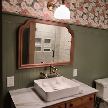 Wilson Interiors - a bathroom with a sink and toilet - General Contractors Near Me Wilson Interiors - a bathroom with a sink and toilet - General Contractors Near Me