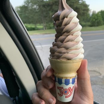 Cascades Ice Cream Company - a hand holding an ice cream cone - Ice Cream & Frozen Yogurt Near Me - Jackson, Michigan Cascades Ice Cream Company - a hand holding an ice cream cone - Ice Cream & Frozen Yogurt Near Me - Jackson, Michigan