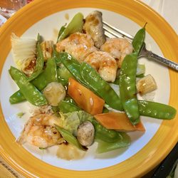 China Star - Shrimp with peapods on a plate at home with garlic sauce that was ordered on the side. Delicious!