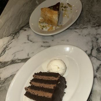 Pinyon - Chocolate cake, and the baklava cheesecake. - Mediterranean Near Me - Scottsdale, Arizona Pinyon - Chocolate cake, and the baklava cheesecake. - Mediterranean Near Me - Scottsdale, Arizona