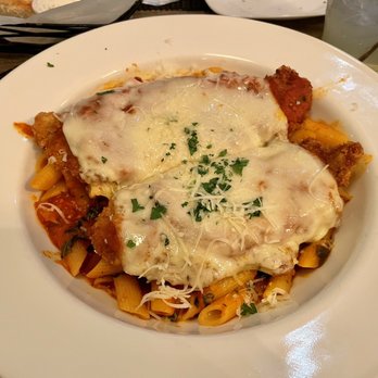 Zina's Cucina - Veal Parmigiana" (breaded veal cutlet with mozzarella over penne pasta tossed in a fresh pomodoro sauce) - Italian Near Me - Marlborough, Connecticut Zina's Cucina - Veal Parmigiana" (breaded veal cutlet with mozzarella over penne pasta tossed in a fresh pomodoro sauce) - Italian Near Me - Marlborough, Connecticut